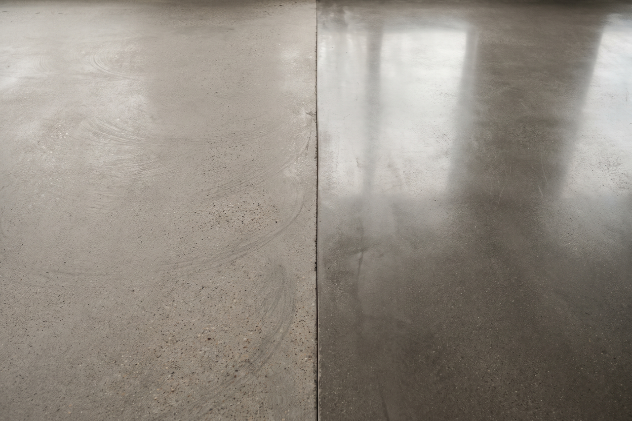 Close view of a concrete slab with one half diamond-ground to an open, even texture and the other half still smooth